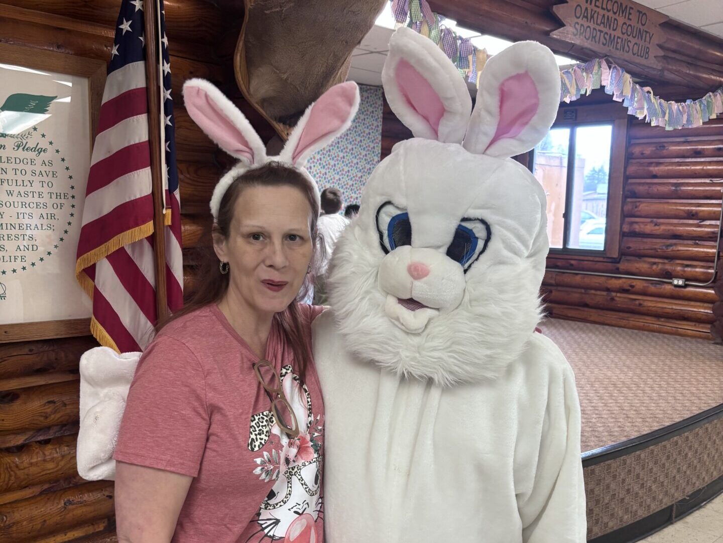 The Easter Bunny Stands with a Volunteer